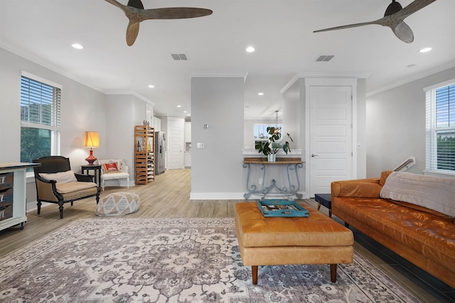 5450 A1A, Saint Augustine, FL 32080 - living room featuring ceiling fan, recessed lighting, crown molding, and light wood-style flooring