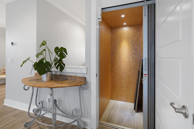 5450 A1A, Saint Augustine, FL 32080 - elevator featuring wood finished floors, ornamental molding, and recessed lighting