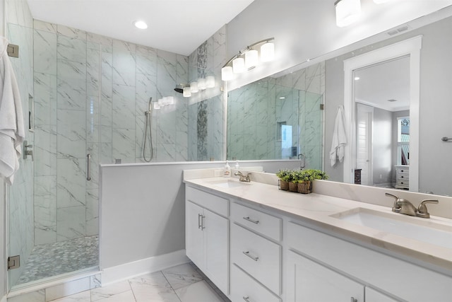 5450 A1A, Saint Augustine, FL 32080 - bathroom featuring marble finish floors, a marble finish shower, double vanity, and recessed lighting