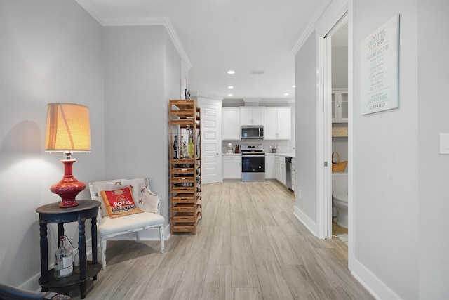 5450 A1A, Saint Augustine, FL 32080 - corridor featuring light wood-style floors, recessed lighting, and crown molding