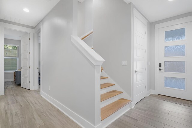 5450 A1A, Saint Augustine, FL 32080 - foyer with light wood-style flooring, stairs, and recessed lighting