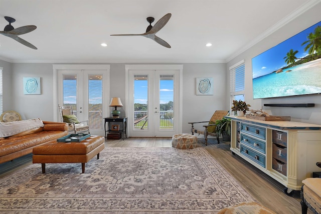 5450 A1A, Saint Augustine, FL 32080 - living room featuring a ceiling fan, french doors, ornamental molding, light wood-type flooring, and recessed lighting