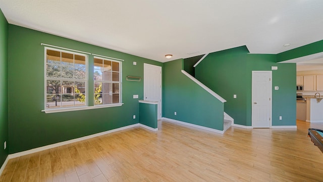 spare room with light hardwood / wood-style flooring