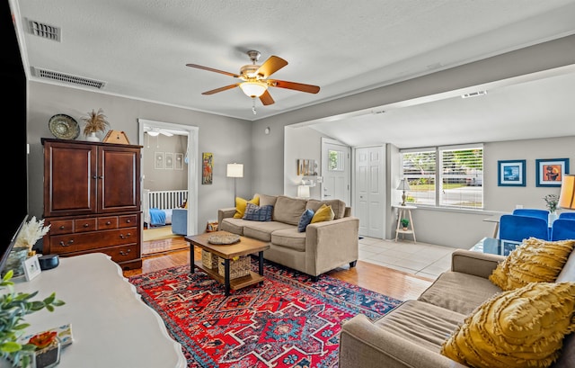 215 Jasmine Rd, Saint Augustine, FL 32086 - living room featuring a ceiling fan, light wood-type flooring, and a textured ceiling