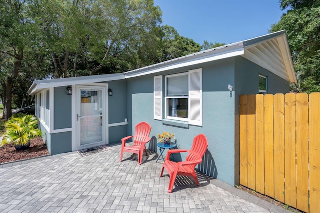 215 Jasmine Rd, Saint Augustine, FL 32086 - view of front of house with a patio area and stucco siding