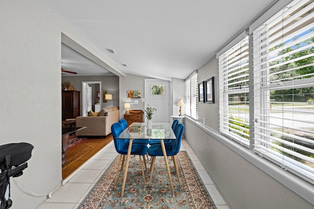 215 Jasmine Rd, Saint Augustine, FL 32086 - dining space featuring light tile patterned flooring and lofted ceiling