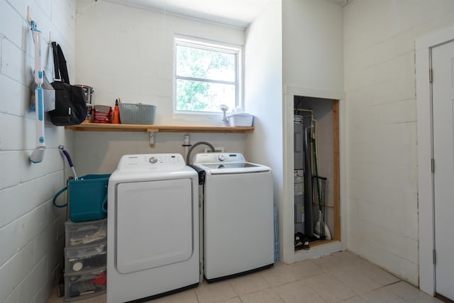 215 Jasmine Rd, Saint Augustine, FL 32086 - laundry room featuring separate washer and dryer, light tile patterned flooring, and concrete block wall