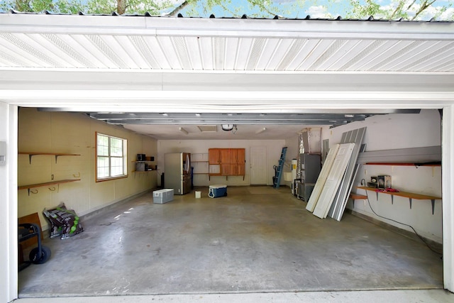 885 Wildwood Dr, Saint Augustine, FL 32086 - garage featuring freestanding refrigerator and heating unit
