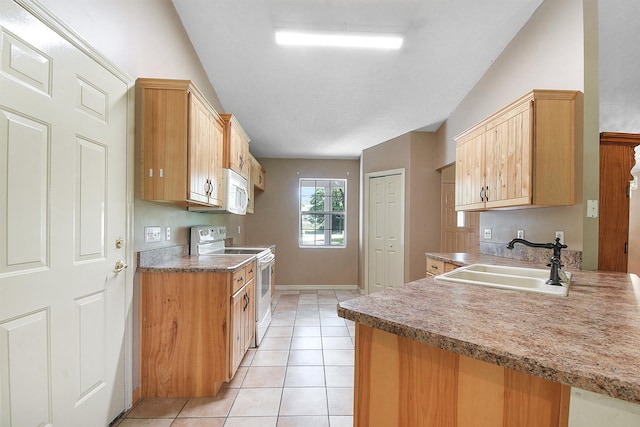 885 Wildwood Dr, Saint Augustine, FL 32086 - kitchen featuring white appliances, light tile patterned floors, and a peninsula