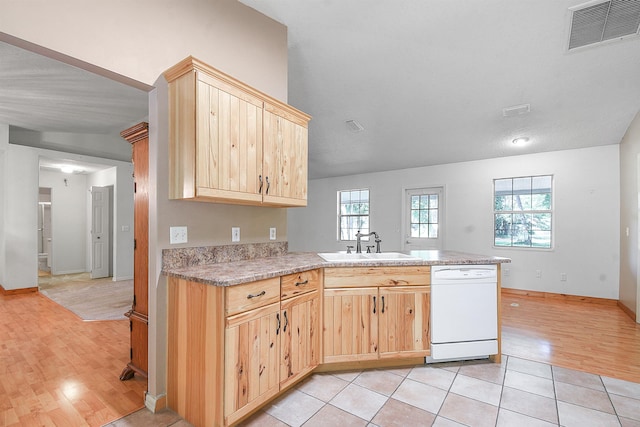 885 Wildwood Dr, Saint Augustine, FL 32086 - kitchen with white dishwasher, light brown cabinetry, a peninsula, and light wood-style floors