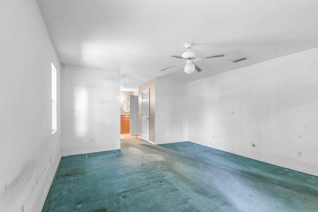 885 Wildwood Dr, Saint Augustine, FL 32086 - carpeted spare room featuring a textured ceiling and a ceiling fan