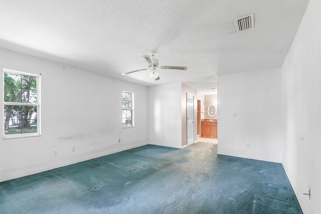 885 Wildwood Dr, Saint Augustine, FL 32086 - unfurnished room featuring carpet, a ceiling fan, and a textured ceiling