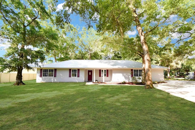 885 Wildwood Dr, Saint Augustine, FL 32086 - single story home with concrete driveway and a metal roof
