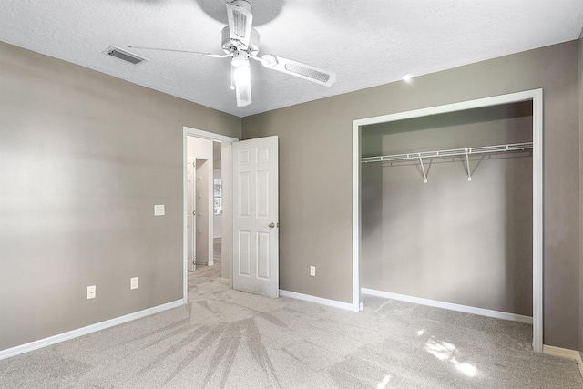 885 Wildwood Dr, Saint Augustine, FL 32086 - unfurnished bedroom featuring a closet, a textured ceiling, carpet, and ceiling fan