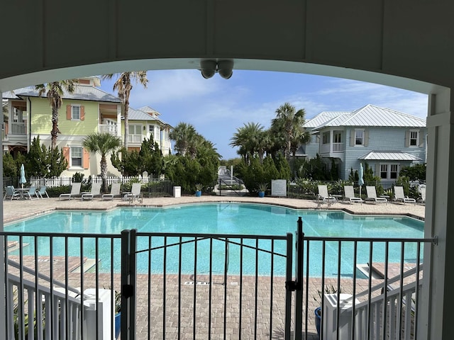 view of swimming pool featuring a patio area