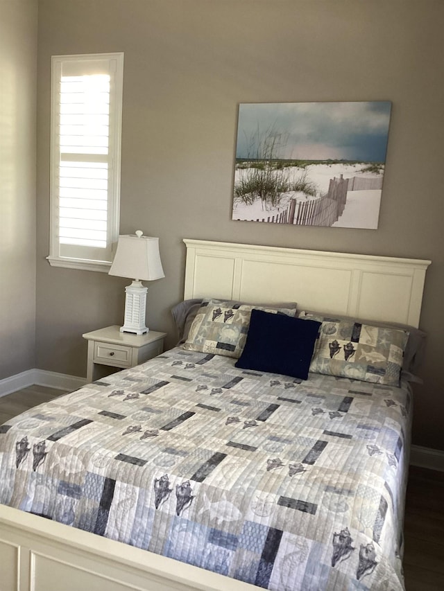 bedroom featuring dark wood-type flooring