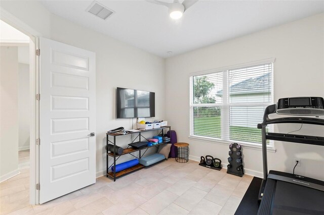 workout room with visible vents and baseboards