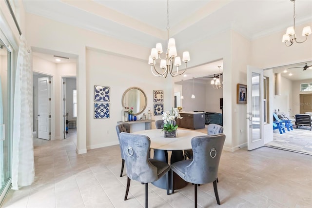 dining room featuring ornamental molding, baseboards, light tile patterned floors, and a chandelier