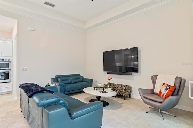 living area featuring light tile patterned flooring, baseboards, visible vents, and ornamental molding