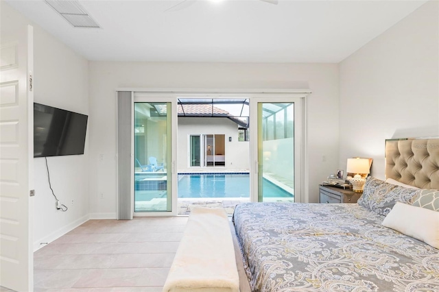 bedroom featuring tile patterned flooring, visible vents, baseboards, and access to outside