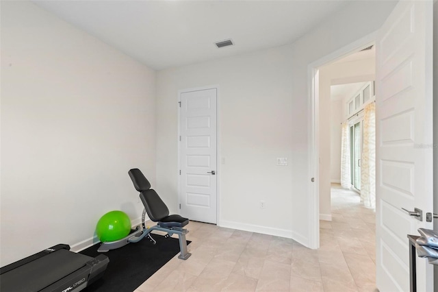 workout area with visible vents and baseboards