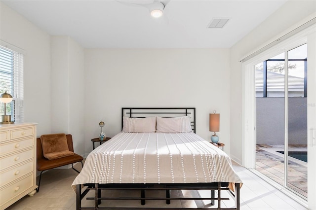 bedroom featuring access to exterior and visible vents