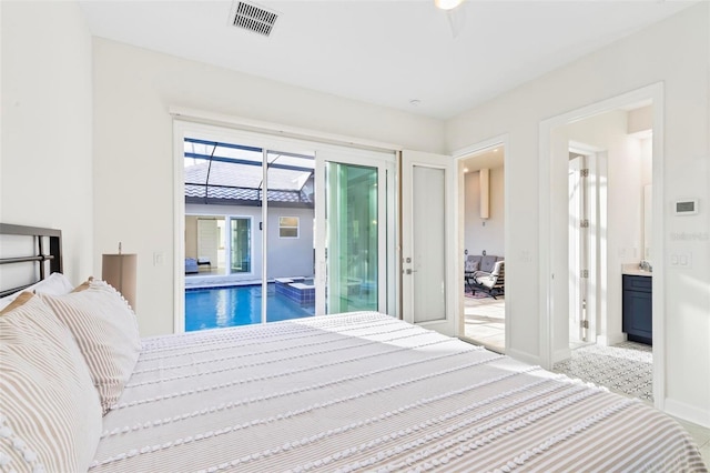 bedroom with access to exterior, visible vents, and baseboards