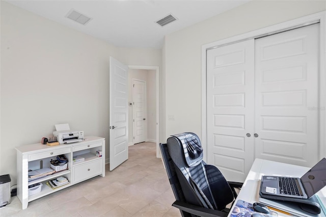 office featuring baseboards and visible vents