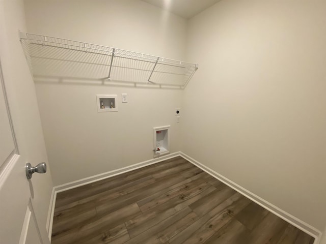 clothes washing area featuring electric dryer hookup, dark hardwood / wood-style flooring, and washer hookup