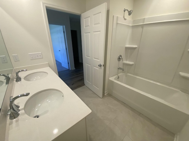 bathroom featuring shower / bathing tub combination and vanity