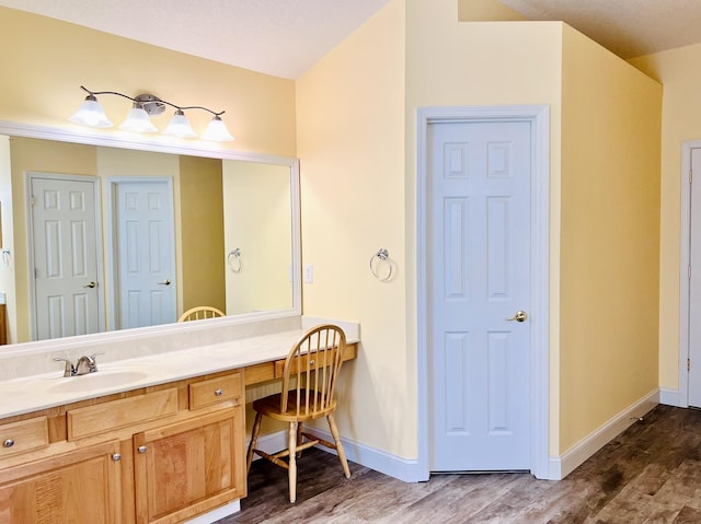 735 E Red House Branch Rd, Saint Augustine, FL 32084 - bathroom featuring vanity, wood finished floors, and baseboards
