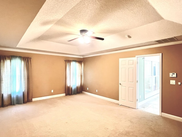 735 E Red House Branch Rd, Saint Augustine, FL 32084 - unfurnished room with light colored carpet, baseboards, visible vents, a raised ceiling, and a ceiling fan
