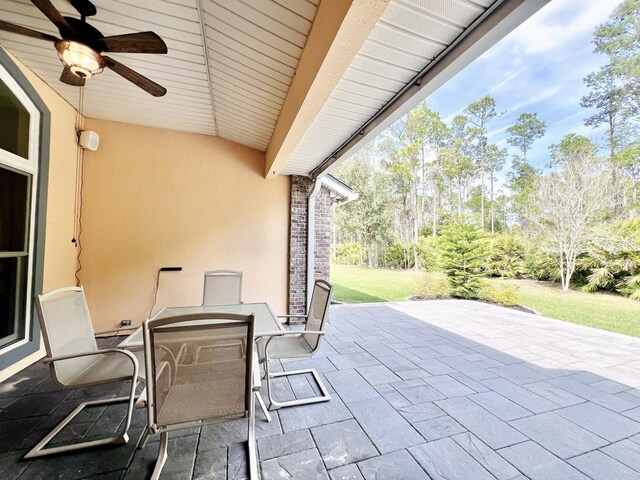 735 E Red House Branch Rd, Saint Augustine, FL 32084 - view of patio featuring ceiling fan and outdoor dining area