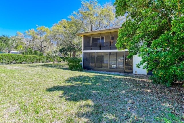 31 Catalonia Ct, Saint Augustine, FL 32086 - back of property featuring stucco siding, a lawn, a ceiling fan, and a sunroom