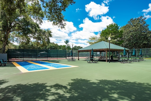 31 Catalonia Ct, Saint Augustine, FL 32086 - view of home's community with a gazebo, a tennis court, and fence