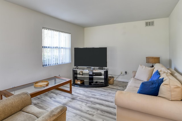 31 Catalonia Ct, Saint Augustine, FL 32086 - living room featuring wood finished floors, visible vents, and baseboards