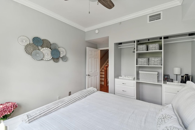 bedroom featuring a closet, ornamental molding, and ceiling fan