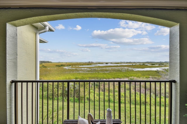 balcony featuring a water view