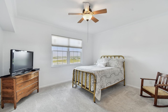 bedroom featuring ceiling fan, light colored carpet, and ornamental molding