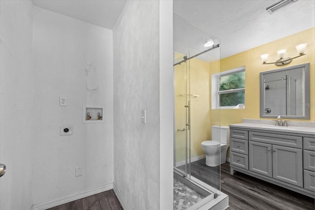342 Euclid Ave, Daytona Beach, FL 32118 - full bath featuring wood finished floors, a shower stall, and vanity