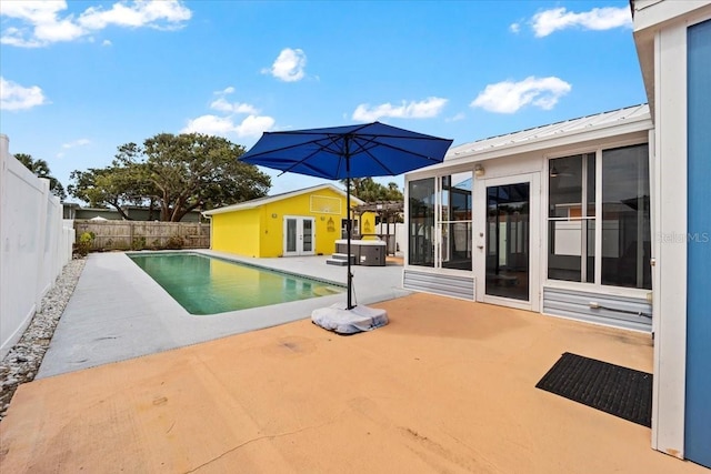 342 Euclid Ave, Daytona Beach, FL 32118 - view of swimming pool with french doors, a patio, a fenced backyard, and an exterior structure