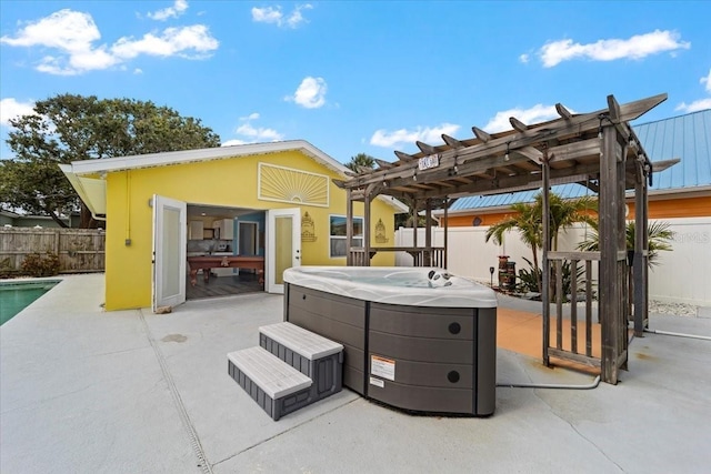 342 Euclid Ave, Daytona Beach, FL 32118 - fenced backyard with a hot tub, a patio, a pergola, and an outdoor structure