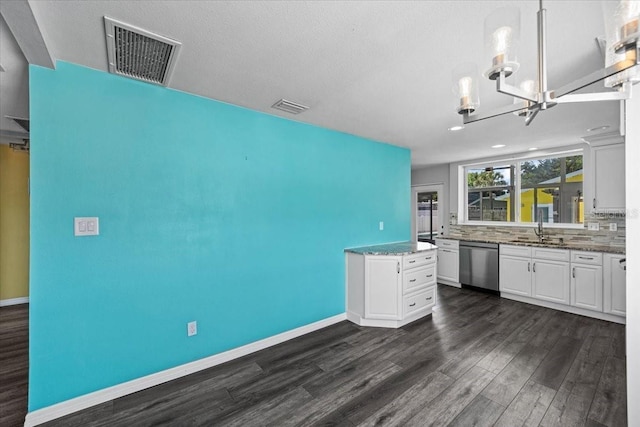 342 Euclid Ave, Daytona Beach, FL 32118 - kitchen featuring stainless steel dishwasher, dark wood-style floors, white cabinets, a chandelier, and light stone countertops