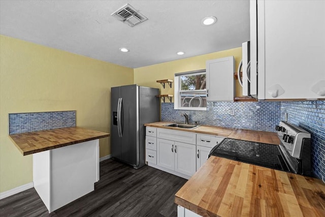342 Euclid Ave, Daytona Beach, FL 32118 - kitchen with butcher block countertops, stainless steel appliances, dark wood-style flooring, open shelves, and recessed lighting