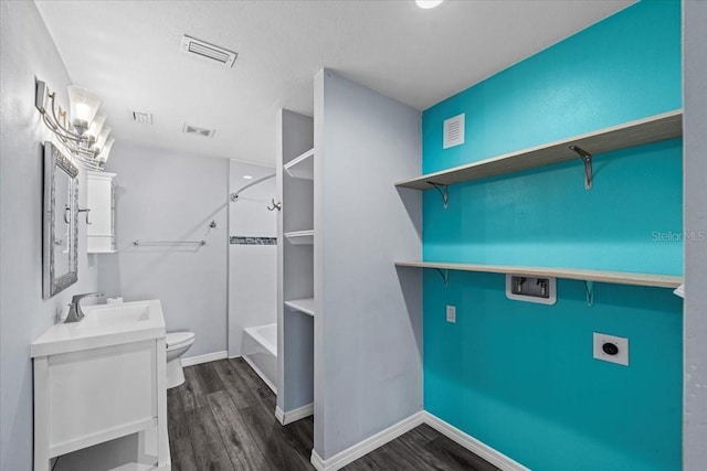342 Euclid Ave, Daytona Beach, FL 32118 - washroom with electric dryer hookup, dark wood-type flooring, and washer hookup