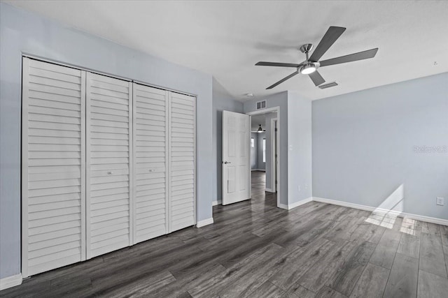 342 Euclid Ave, Daytona Beach, FL 32118 - unfurnished bedroom featuring a closet, wood finished floors, and ceiling fan