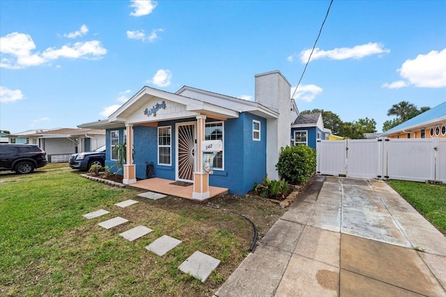 342 Euclid Ave, Daytona Beach, FL 32118 - view of front facade featuring a gate, stucco siding, a porch, and concrete driveway
