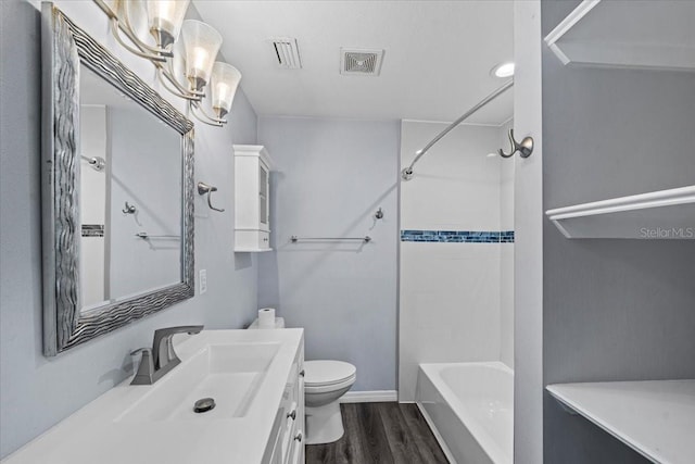 342 Euclid Ave, Daytona Beach, FL 32118 - full bath with wood finished floors, vanity, and tub / shower combination