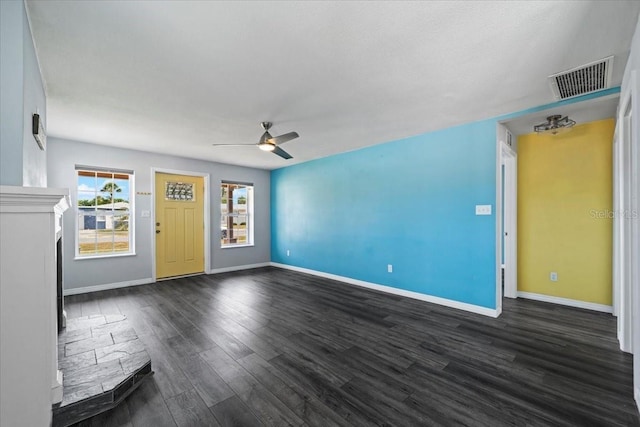 342 Euclid Ave, Daytona Beach, FL 32118 - unfurnished living room with dark wood finished floors and a ceiling fan
