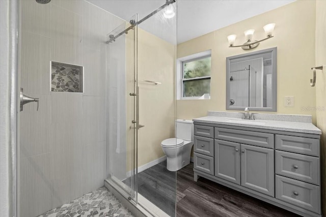 342 Euclid Ave, Daytona Beach, FL 32118 - full bath featuring a shower stall, vanity, and wood finished floors